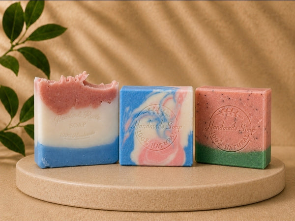 Render & Roots Summer Collection handmade tallow soaps on a stone pedestal